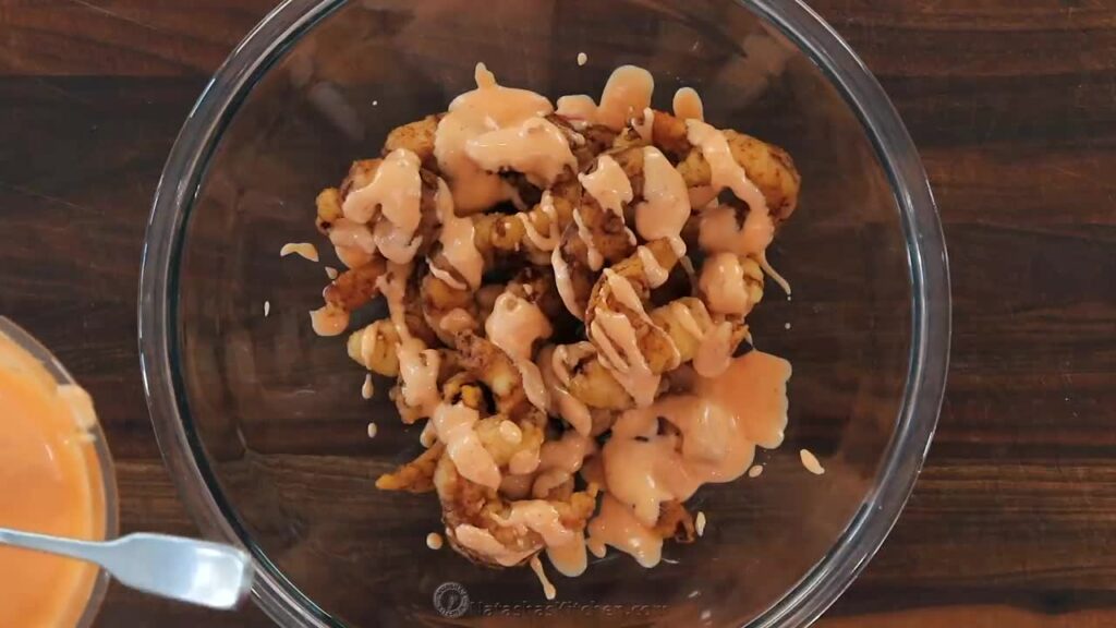 Coating shrimps in the sauce