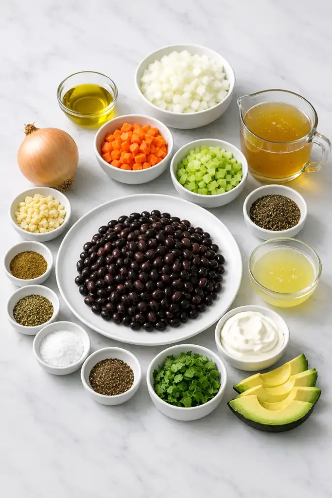 Fresh ingredients for Black Bean Soup, including black beans and vegetables